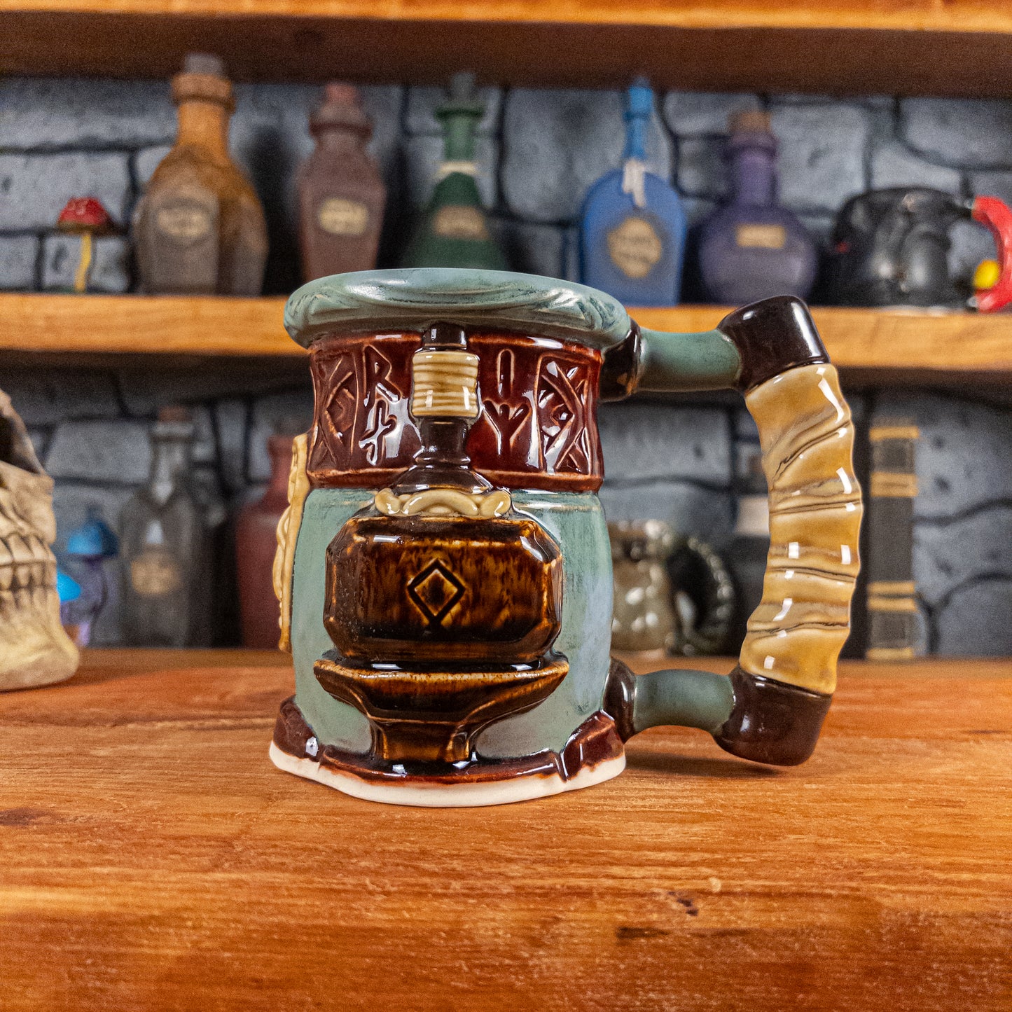 The right side view of a handmade Dwarven Mug designed to look like a greenish-blue and dark red barrel with intricate rune carvings, a partial dark beige dwarf face, and a hammer and anvil design, showing the detailed handle.