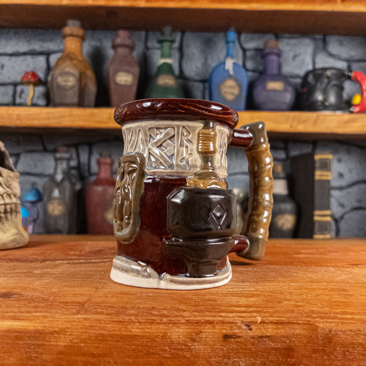 Three-quarter right side view of a handmade Dwarven Mug designed to look like a wine red and light sand barrel with intricate rune carvings, a dark brown dwarf face, and a hammer and anvil design, showing the detailed handle.