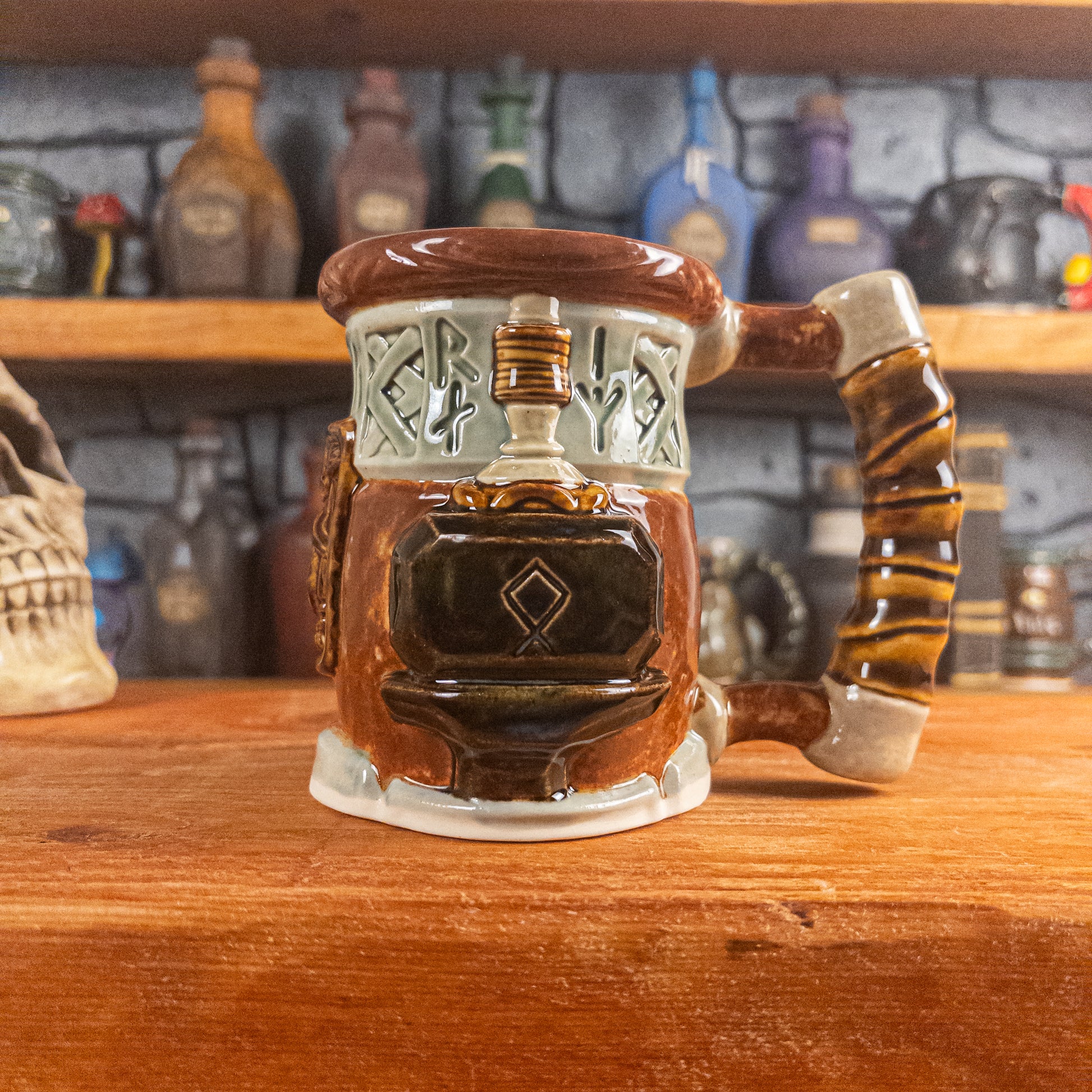 The right side view of a handmade Dwarven Mug designed to look like a light green and reddish brown barrel with intricate rune carvings, a partial dwarf face, and a hammer and anvil design, showing the detailed handle.