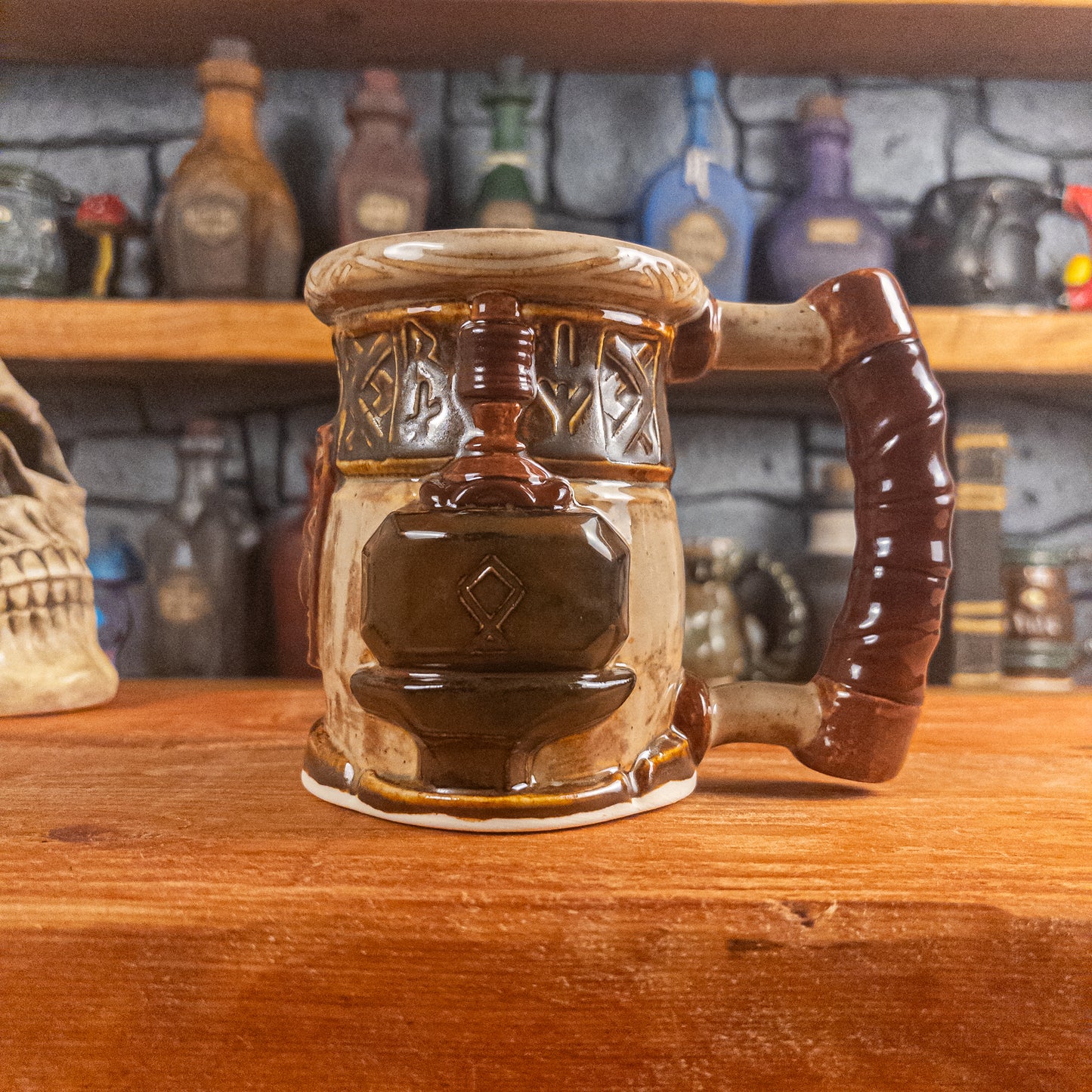 The right side view of a handmade Dwarven Mug designed to look like a beige and dark brown barrel with intricate rune carvings, a partial brown dwarf face, and a hammer and anvil design, showing the detailed handle.