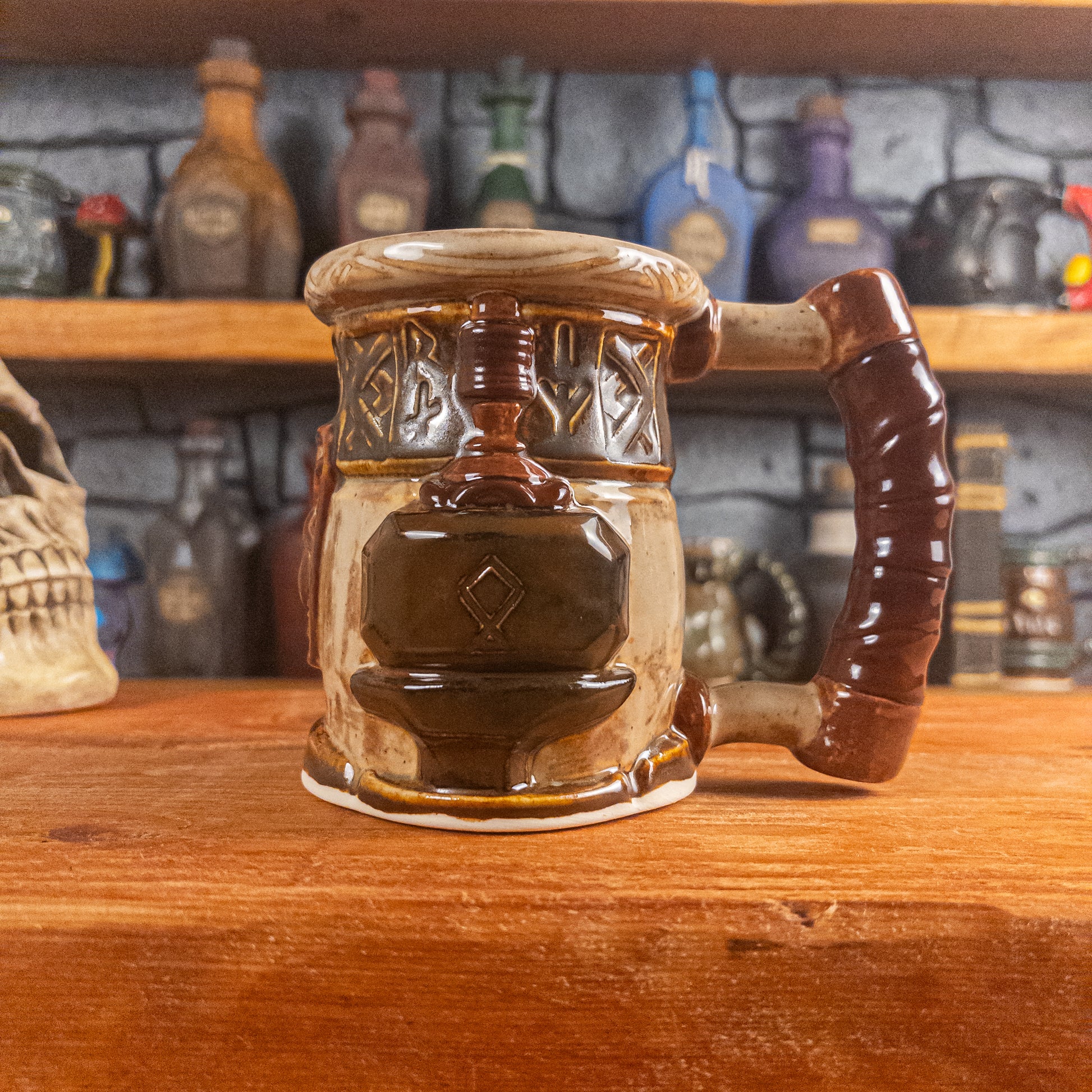 The right side view of a handmade Dwarven Mug designed to look like a beige and dark brown barrel with intricate rune carvings, a partial brown dwarf face, and a hammer and anvil design, showing the detailed handle.