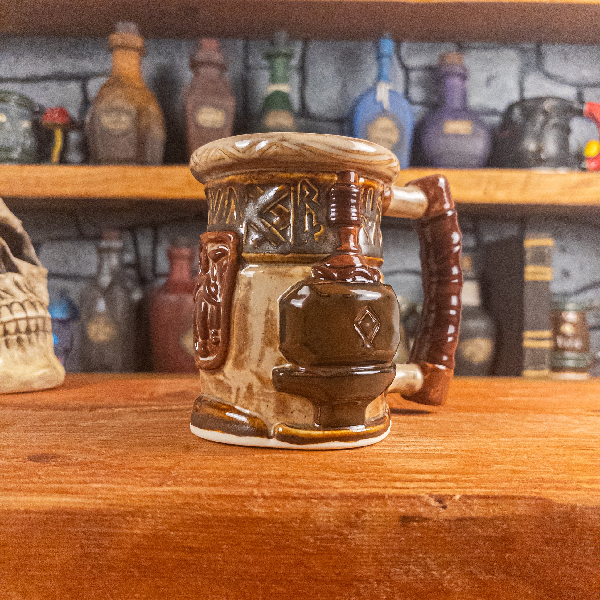 Three-quarter right side view of a handmade Dwarven Mug designed to look like a beige and dark brown barrel with intricate rune carvings, a brown dwarf face, and a hammer and anvil design, showing the detailed handle.