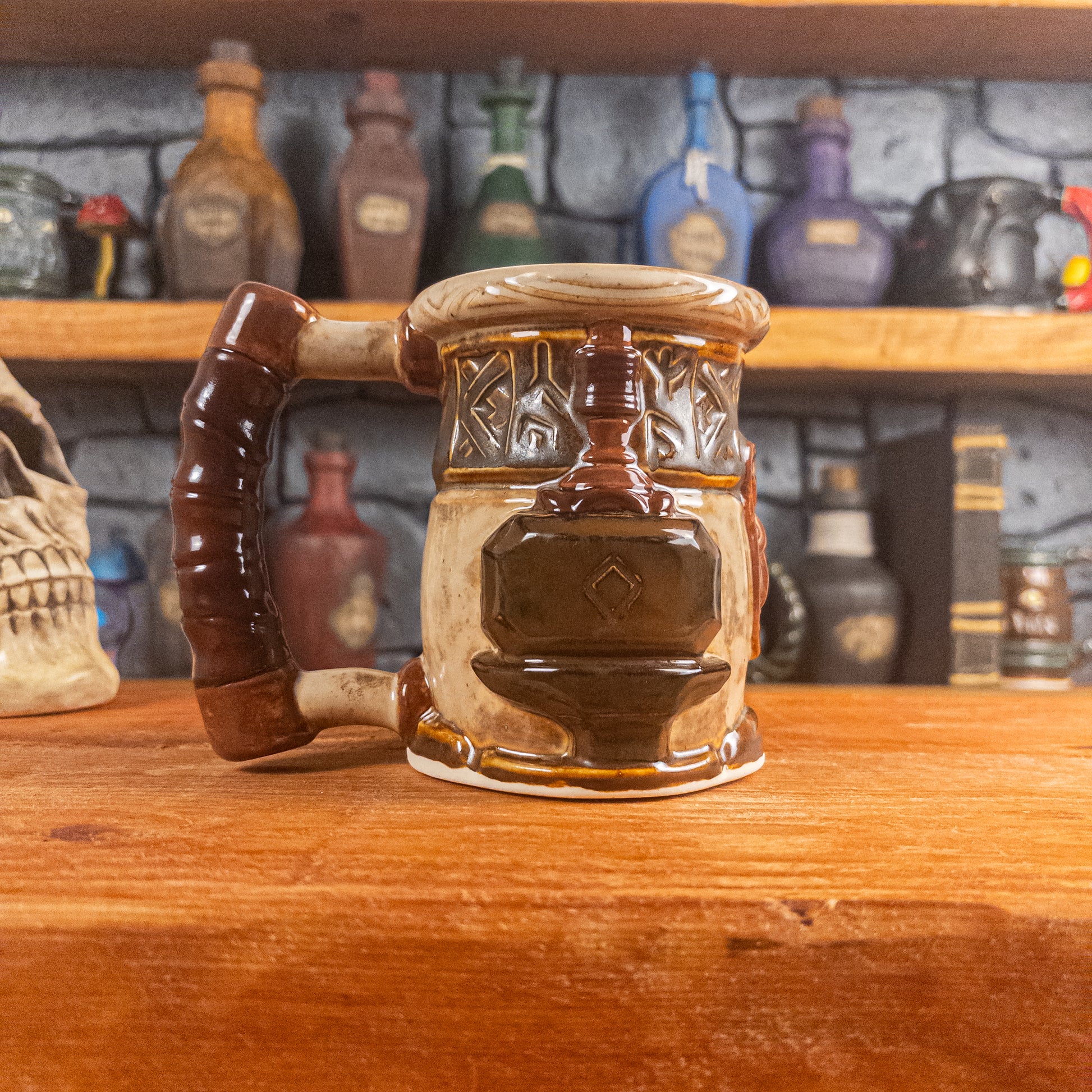 Left side view of a handmade Dwarven Mug designed to look like a beige and dark brown barrel with intricate rune carvings, a partial brown dwarf face, and a hammer and anvil design, showing the detailed handle.